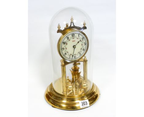 A brass 400 day clock under dome