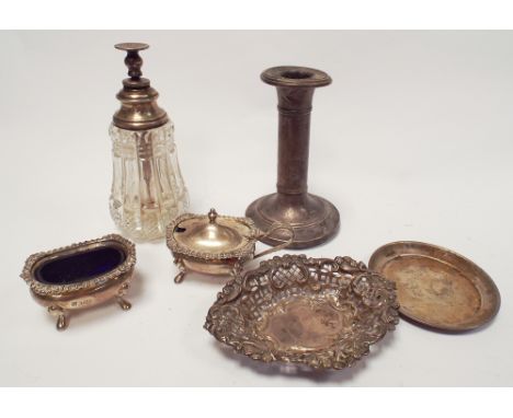 A collection of small silver items to include condiments, sweetmeat dishes, candlestick
