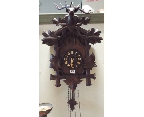 A Black Forest style Cuckoo clock with deer mount