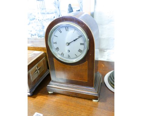 An Edwardian dome topped mantle clock in inlaid mahogany case