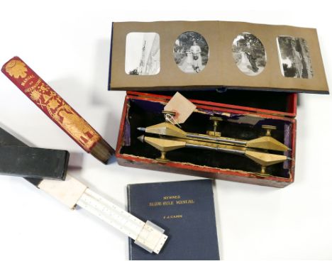Brass caliper gauge in box, photo album, manual of Freemasonry and a slide rule 