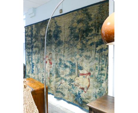 Large antique Flemish Verdure tapestry depicting an  allegorical scene Cupid pursuing a maiden through a wooded landscape, ru