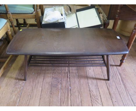 An Ercol dark stain rectangular coffee table with turned undershelf, 105cm wide.