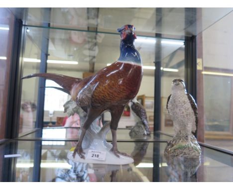 A Rosenthal figure of a pheasent modelled by T. Karner, 29cm high and a Beswick model of an Osprey for Beneagles blended scot