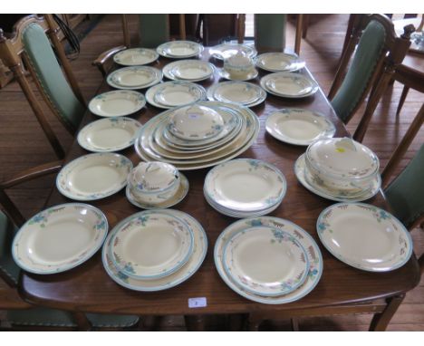A Clarice Cliff Wilkinson dinner service with blue floral design border including six meat plates, large tureen, two small tu