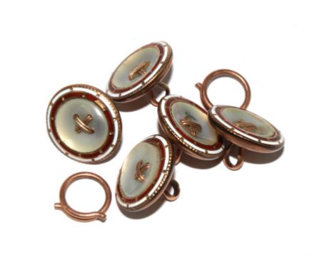 A set of dress buttons set with mother of pearl and red and white enamel borders