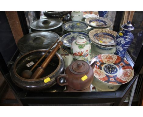 Various Oriental ceramics, all 20th Century, including plates in imari colours, terracotta teapot, ginger jar, and vase, a cl