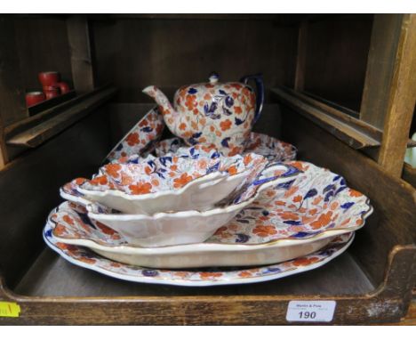 A Victorian teapot, with all over red and blue floral decoration, and various other matching bowls and dishes