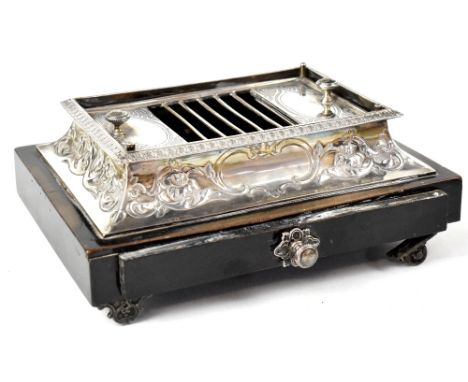 A Victorian hallmarked silver table cigarette box, cigarette roller, lift-off top with lidded compartment to either side for 