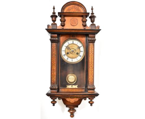 A mahogany Vienna wall clock, the ivorine chapter ring set with Roman numerals, within a case with stained floral borders, be