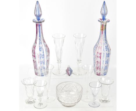 A pair of 19th century Venetian glass decanters with alternating clear, ruby and blue glass panels with grape and vine decora