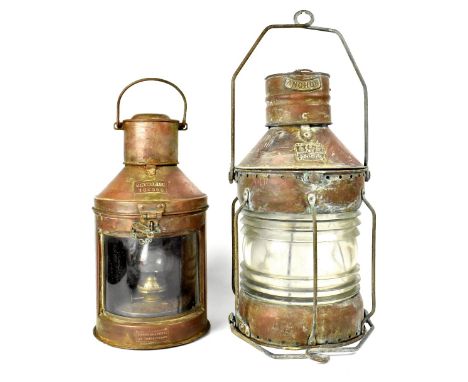A brass ship's lamp by Anchor with a plate stamped 'Seahorse GB no.20502', with clear glass and swing carrying handle, height