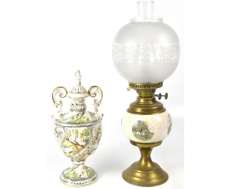 An early 20th century ceramic oil lamp decorated with hunting scenes, white glass opaque shade with etched floral design, to 