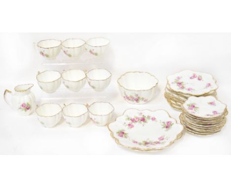 A floral decorated and gilt heightened 'CSC The Paragon China' tea service comprising nine cups, eleven saucers, ten side pla