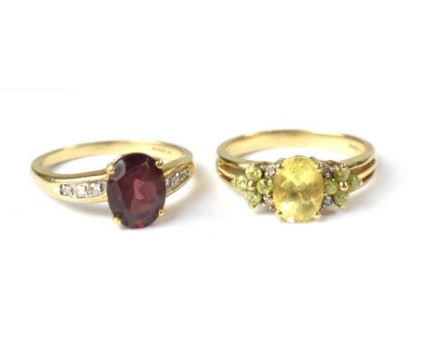 Two modern 9ct gold fashion rings, one with a marquise cut citrine flanked by two small flower heads comprising four small pe