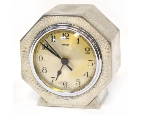 FERRANTI; an Art Deco style beaten pewter clock, the silvered dial set with Arabic numerals, height 13cm. CONDITION REPORT Pl