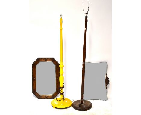 A yellow painted standard lamp with turned column, together with one other, a 1930s bevelled edge mirror with wooden surmount