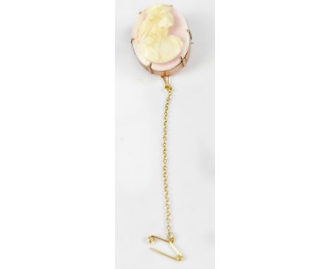 A 9ct gold oval brooch set with pink cameo of Hermes, indistinctly stamped, height 3cm, on a plated safety chain, approx 10g.