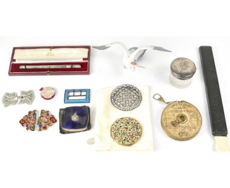 A collectors' lot comprising a boxed Garrards silver comb attachment, a silver topped dressing table jar, a metal and diamant