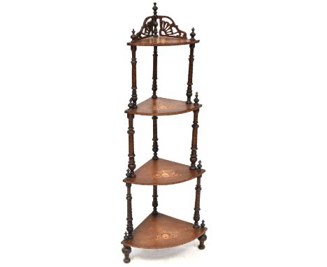 A 19th century inlaid mahogany four-tier whatnot, fan and shell carved top with urn finials, to turned supports, each shelf w