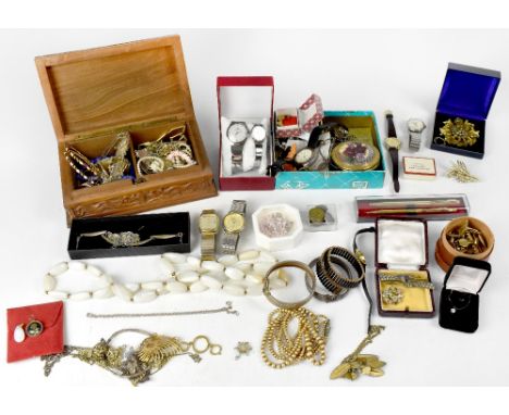 A quantity of costume jewellery to include vintage brooches, necklaces, watches, compact, bead necklaces, a silver bangle, ge