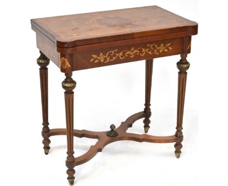 A reproduction mahogany quarter veneered and floral inlaid fold-over games table, interior with chess board within a swag and