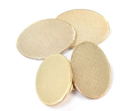 A pair of vintage gentlemen's hallmarked 9ct gold oval cufflinks with engine turned pattern and united by small chains, combi