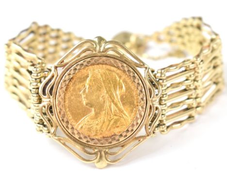 A 19th century 9ct gold seven bar gate bracelet with a Queen Victoria 1899 sovereign in 9ct gold coin mount to the middle, un