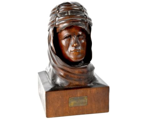 T E LAWRENCE; an early 20th century one-piece hand carved oak portrait bust depicting Lawrence of Arabia wearing desert headd