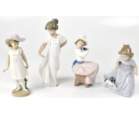 NAO; five figures of young girls in various poses, to include a reclining ballerina, a young girl in Edwardian sun dress, a g