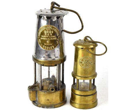 An M &amp; QGR 6 safety lamp, no.6, height 25cm, and a commemorative musical model of a safety lamp, height 16.5cm (2).