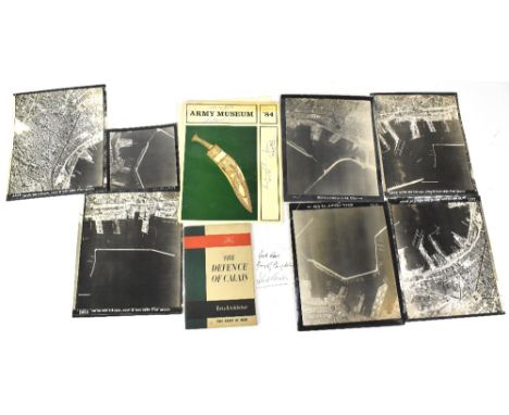 A group of ephemera relating to the military including seven black and white aerial photographs taken during WWII, a slip of 
