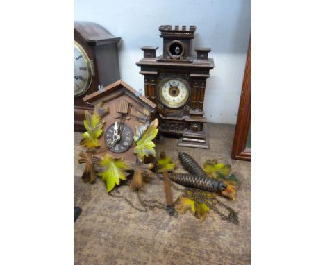 A late 19th Century German oak architectural cased cuckoo mantle clock and a wall mounted cuckoo clock 