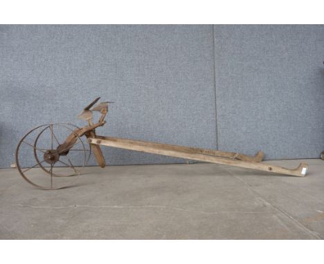A vintage cast iron cultivator 