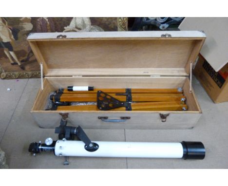 A cased telescope on tripod stand 