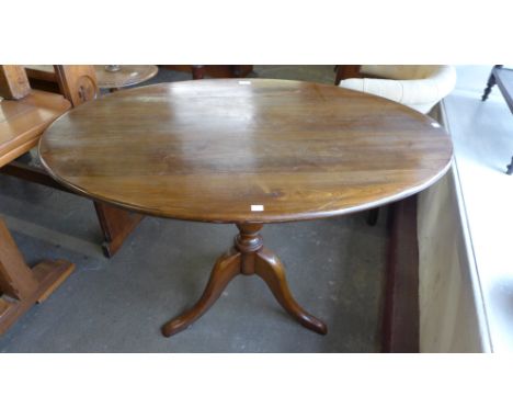 A beech oval tripod loo table 