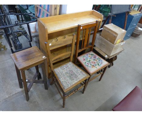 A light oak bookcase, two chairs, an oak nest of tables, two wooden boxes, etc. 