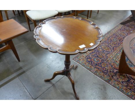 A George III mahogany circular pie crust tripod table 