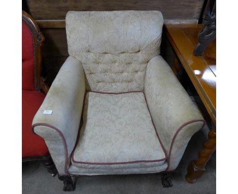 An early 20th Century Chippendale Revival carved mahogany and fabric upholstered armchair 