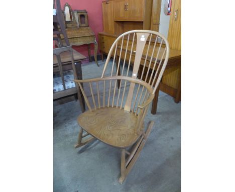 An Ercol Blonde elm and beech Chairmaker's rocking chair 