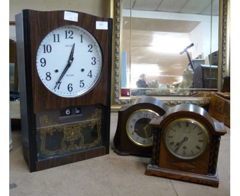 A Seiko 30-day clock, a Smiths Enfield Bakelite clock and an oak cased mantel clock 