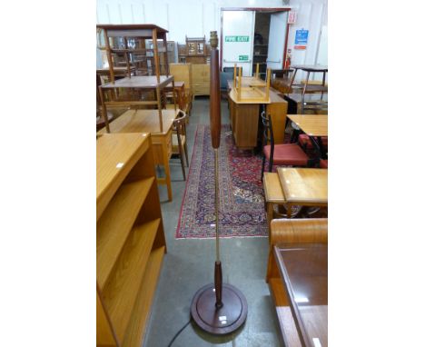 A teak standard lamp 