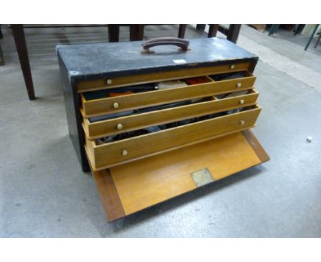 An early 20th Century painted wooden fitted engineers tool chest, with tools 