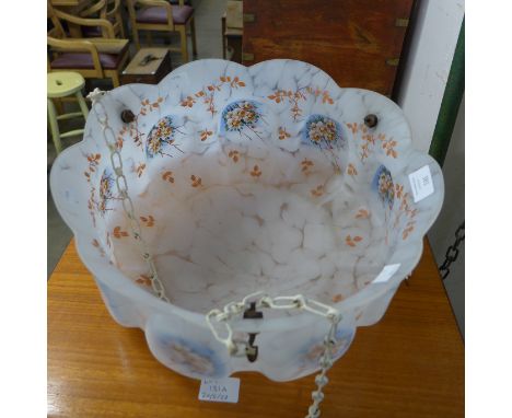 A vintage painted glass light shade 