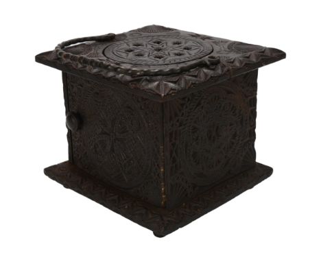 18th century oak carriage foot-warming stool, chip carved decoration allover with iron swing handle, width 24cm, height 20cmG