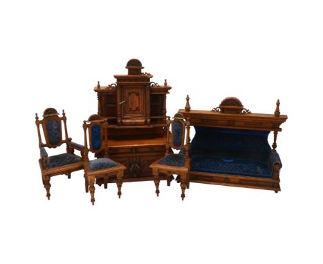 A set of early 20th century oak dolls furniture, dresser, upholstered sofa and two chairs, dresser height 36cmSurface dirt an