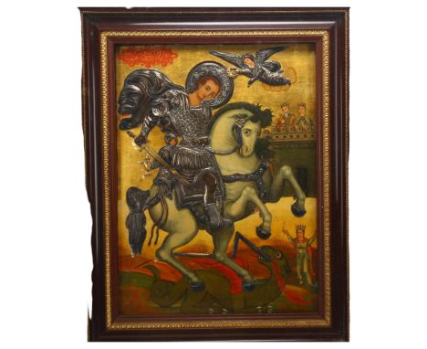 A Greek 18th century icon depicting St George and the Dragon, hand painted and gilded panel with applied embossed unmarked si