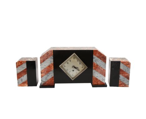 A French Art Deco two-colour marble and slate-cased mantel clock garniture, replacement quartz mechanism, clock width 35cm 