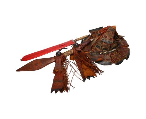 Mandinka decorated leather sword and hat, and a Masai sword with red leather scabbard 