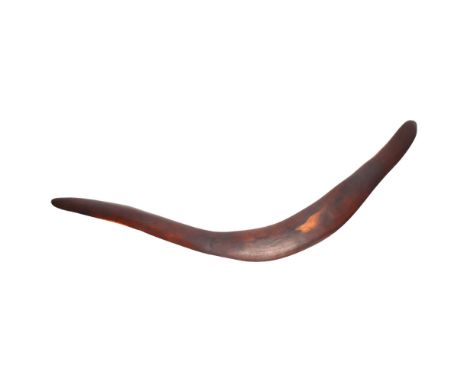 A large Australian Aboriginal hardwood boomerang, with faint engraved geometric designs, length 87cmGood original condition, 